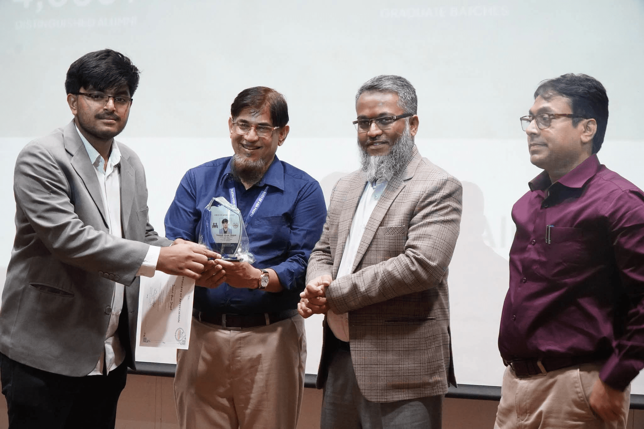 Samiul Alam Shajal receiving a Crest of Appreciation at University of Asia Pacific